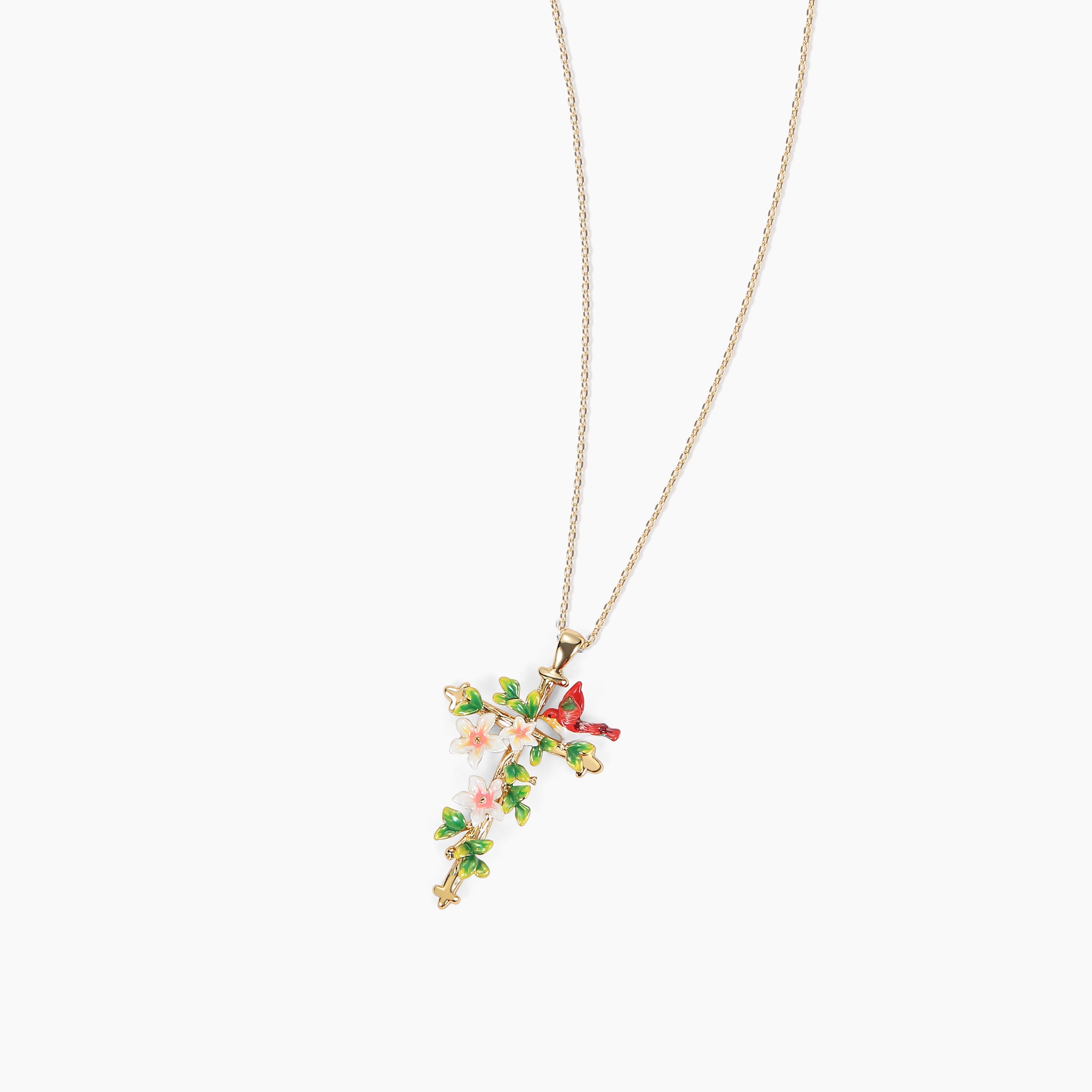 Close-up product image of Abellé’s limited-edition enamel floral cross necklace with bird and blossom details, plated in 18K gold.