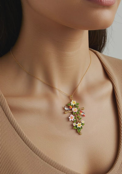 Model wearing Abellé’s limited-edition enamel cross necklace.